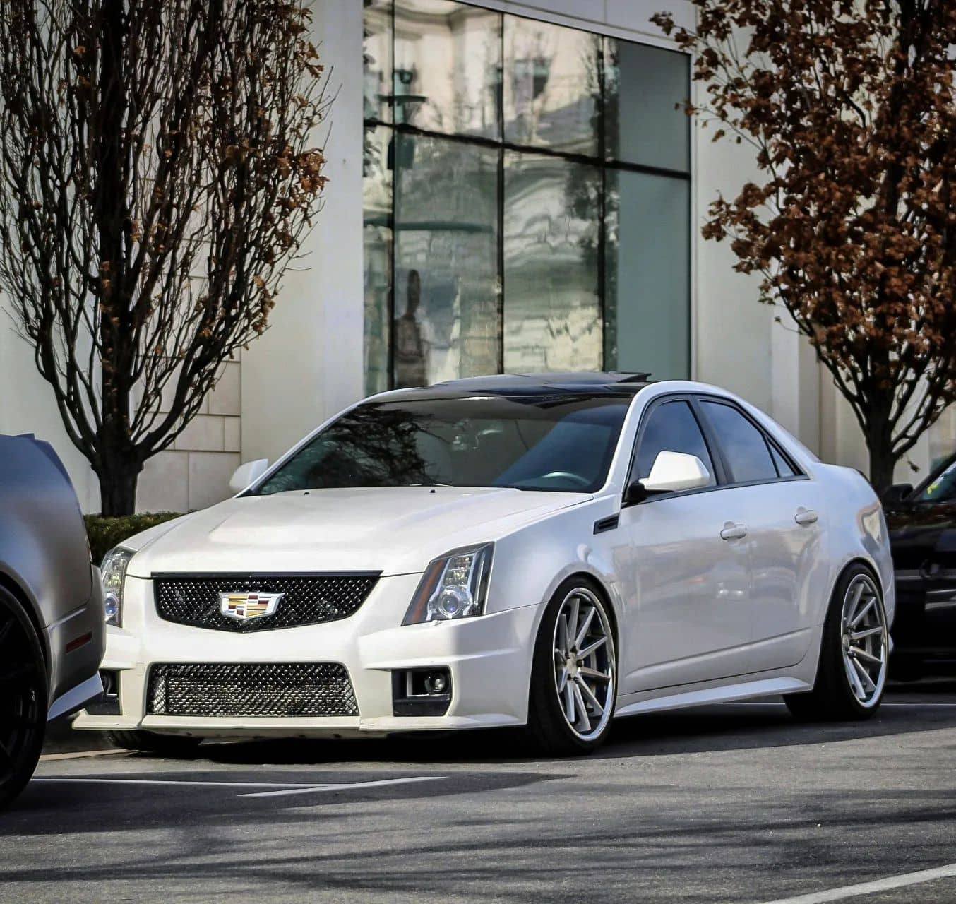 Stanced Cadillac CTS-V on Ferrada FR4 wheels, 20x9 with 245 tires up front and 20x10.5 with 285 tires in the rear
