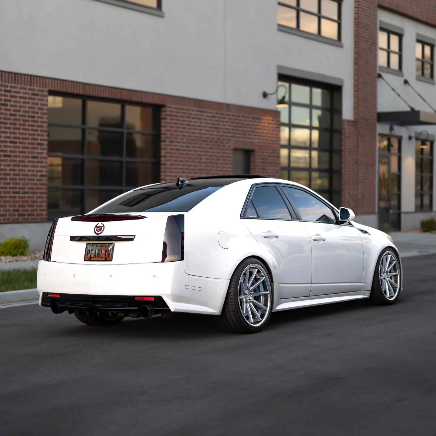 White Cadillac CTS-V sedan white with black taillights and chrome delete