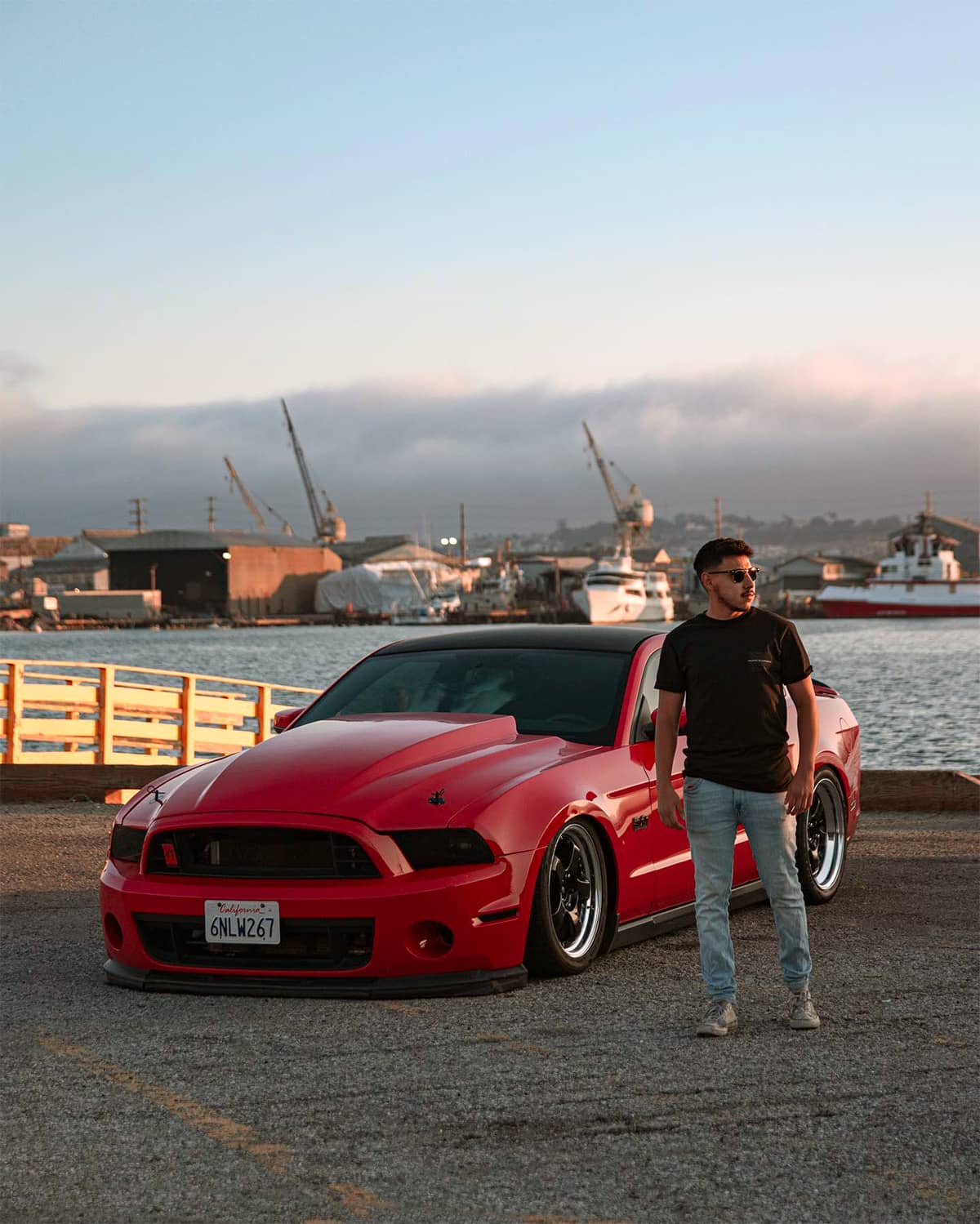 Slammed Ford Mustang GT 5.0 with Airlift air suspension red with black headlight covers