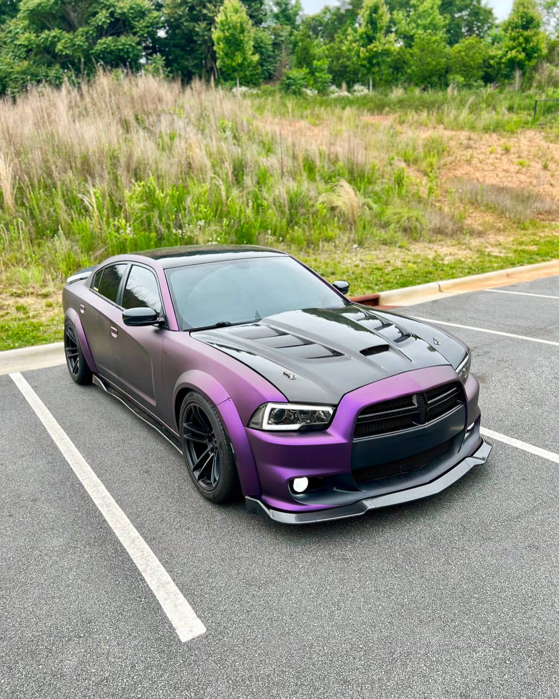 2012 Dodge Charger with custom wide body kit and RGB headlights