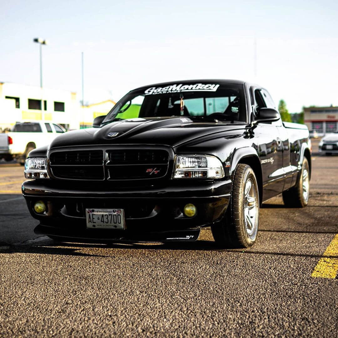 Black Dodge Dakota R/T with a blacked out custom grille