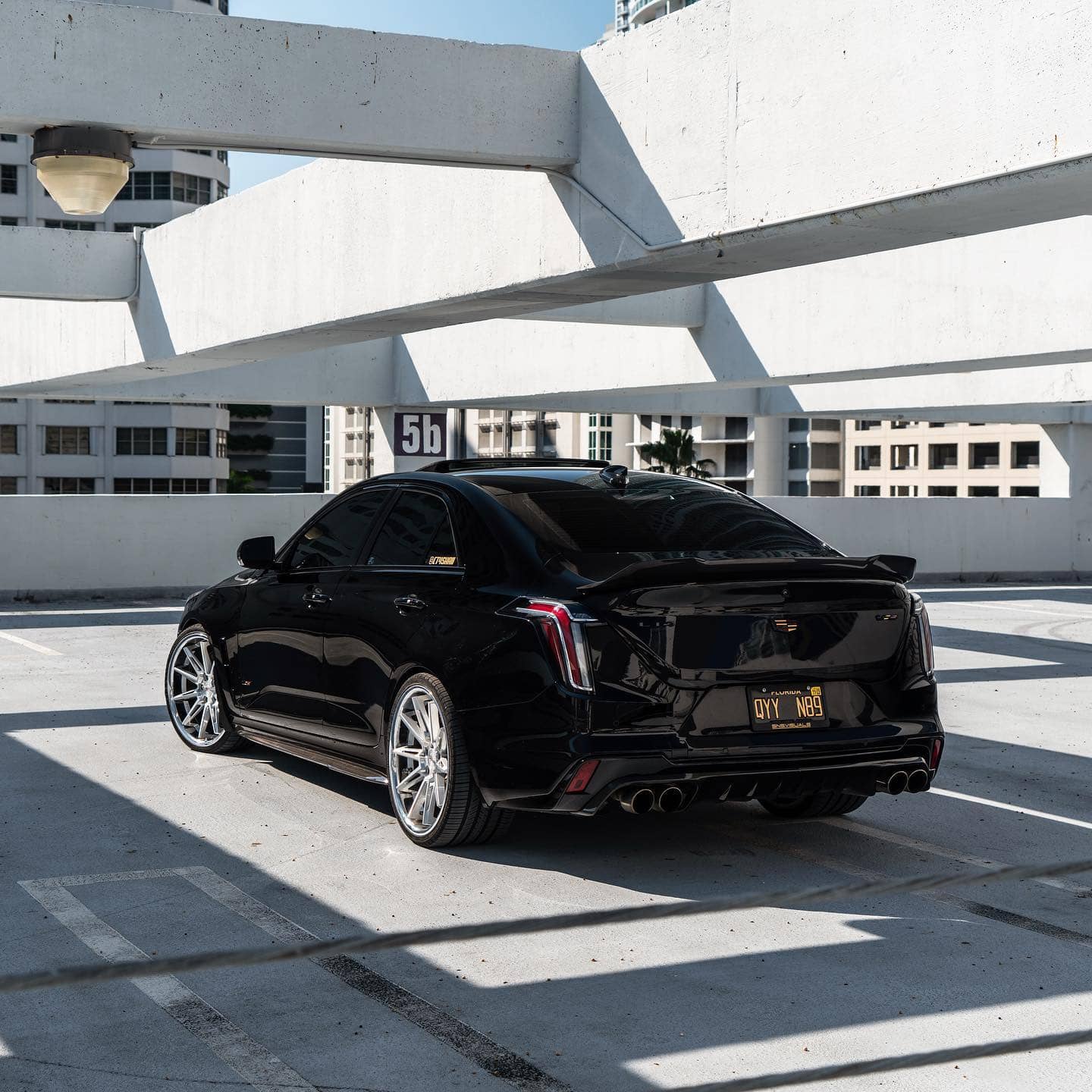 Blacked out Cadillac CT4-V blackwing with custom rear spoiler and diffuser