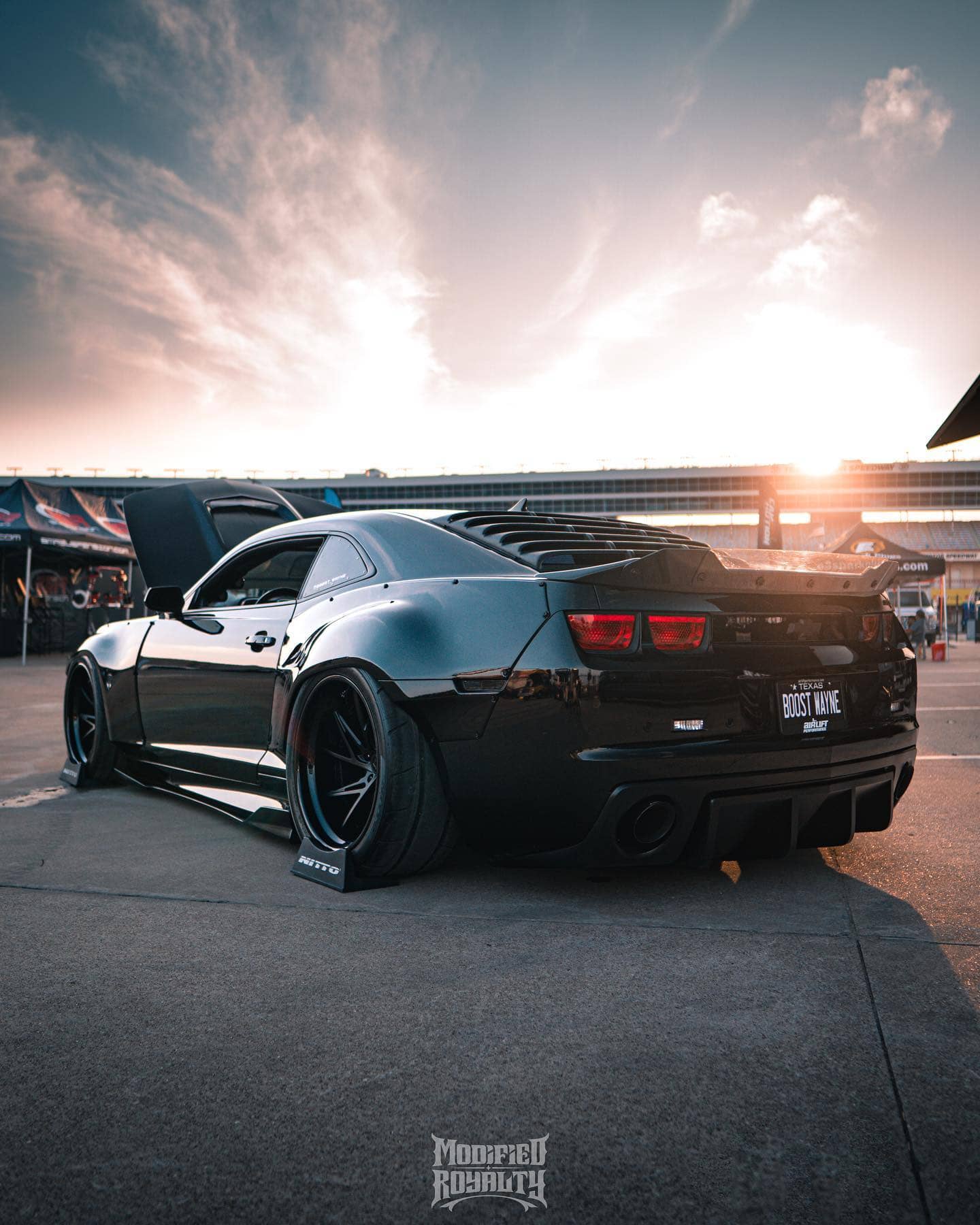 Modded Chevy Camaro SS 5th gen with wide body kit and air suspension