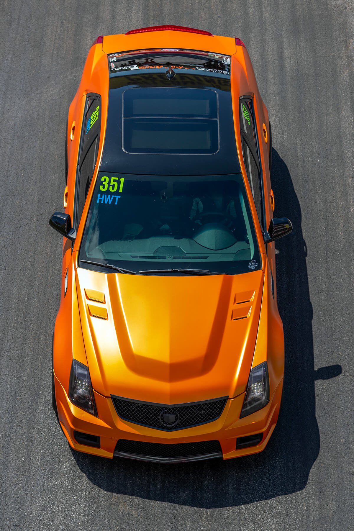 2nd Gen Cadillac CTS-V sedan in orange color with black roof 