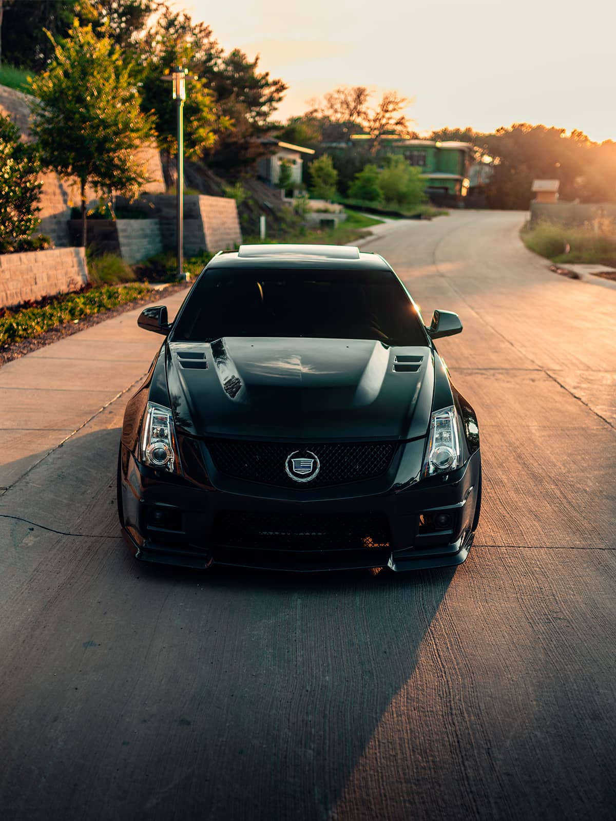 Blacked Out Cadillac CTS-V sedan with custom WEAPON-X Power Extractor Carbon Fiber Hood