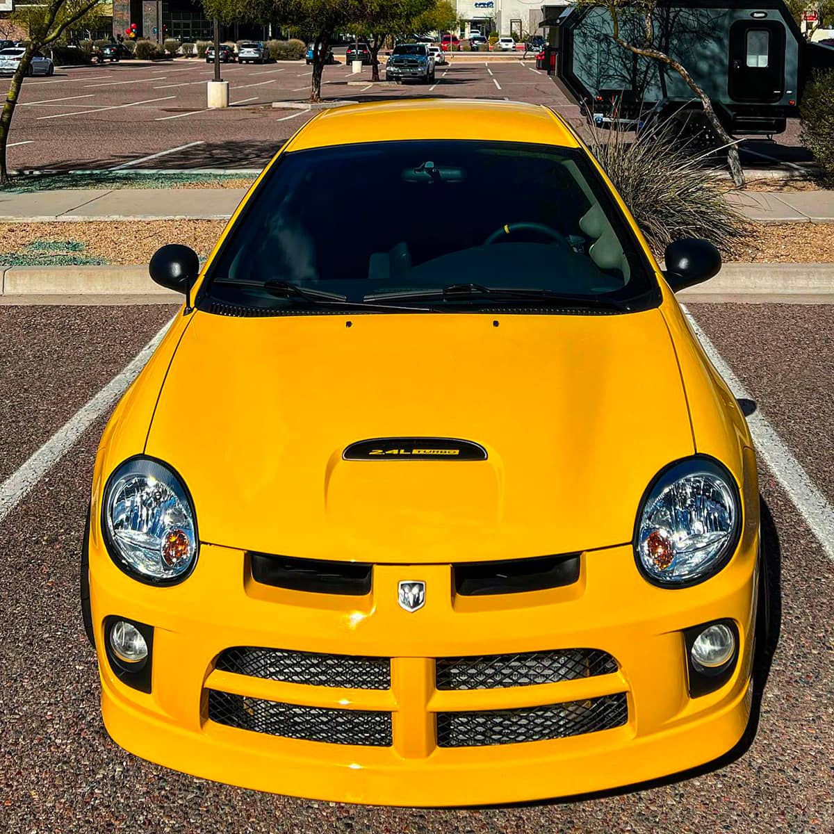 Dodge Neon SRT4 front bumper with intercooler and black grille with hood scoop