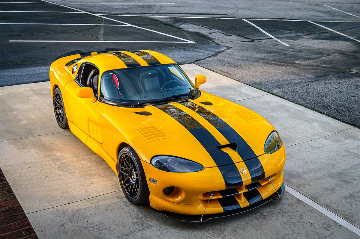 Yellow Dodge Viper with Black stripes, blacked out headlights and black rims