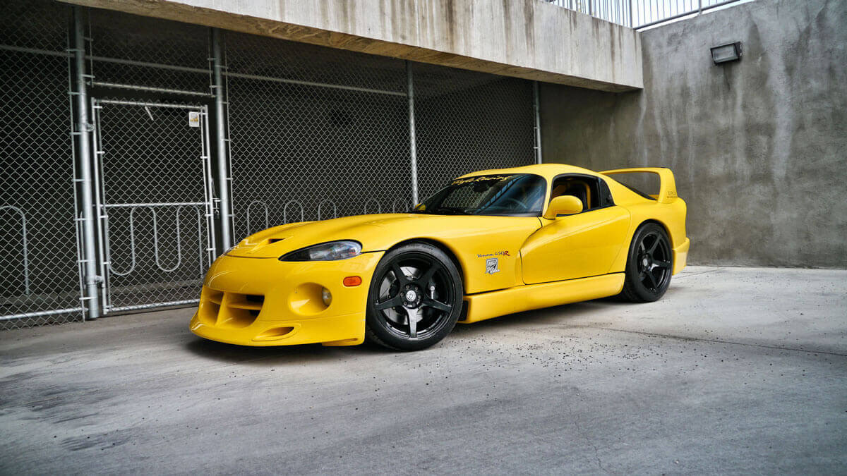 Performance version of a Dodge Viper in yellow color with black wheels