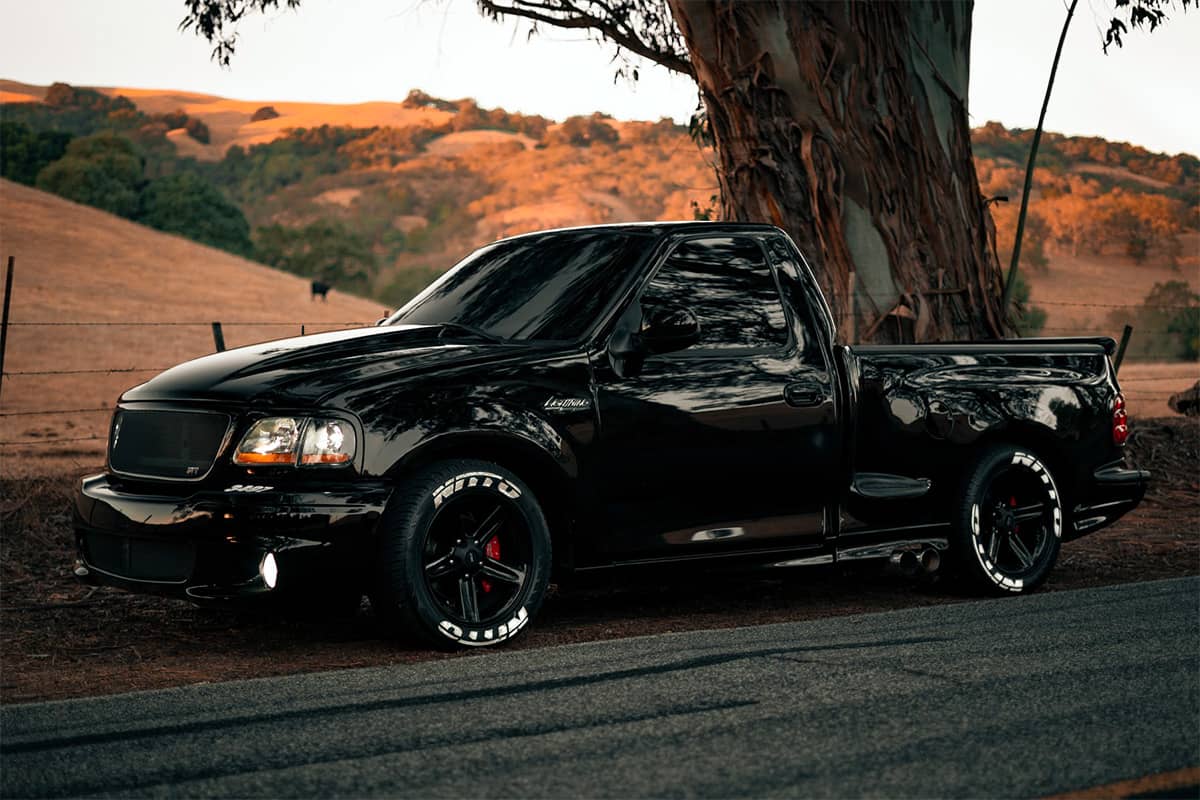 Blacked out Ford F150 Lightning single cab short bed