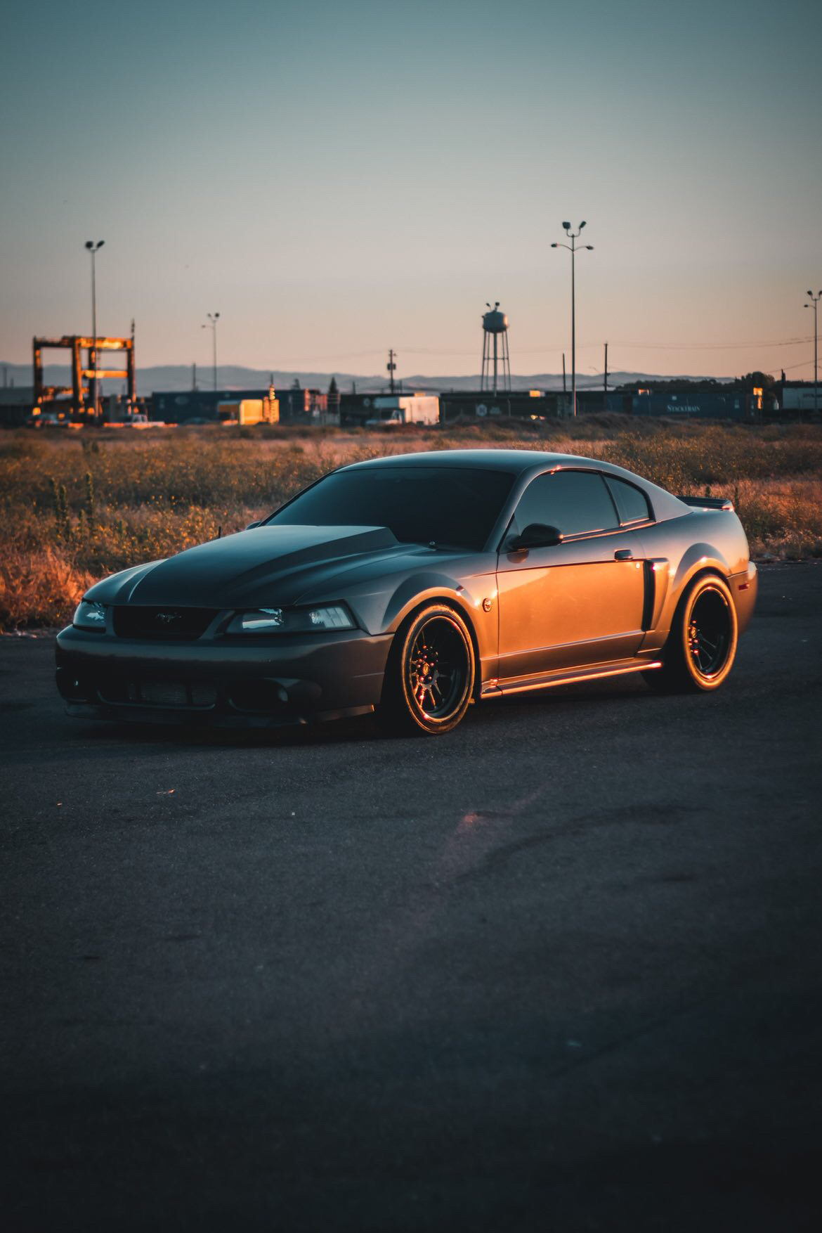 2004 Ford Mustang Mach 1 with a cowl hood and a supercharger