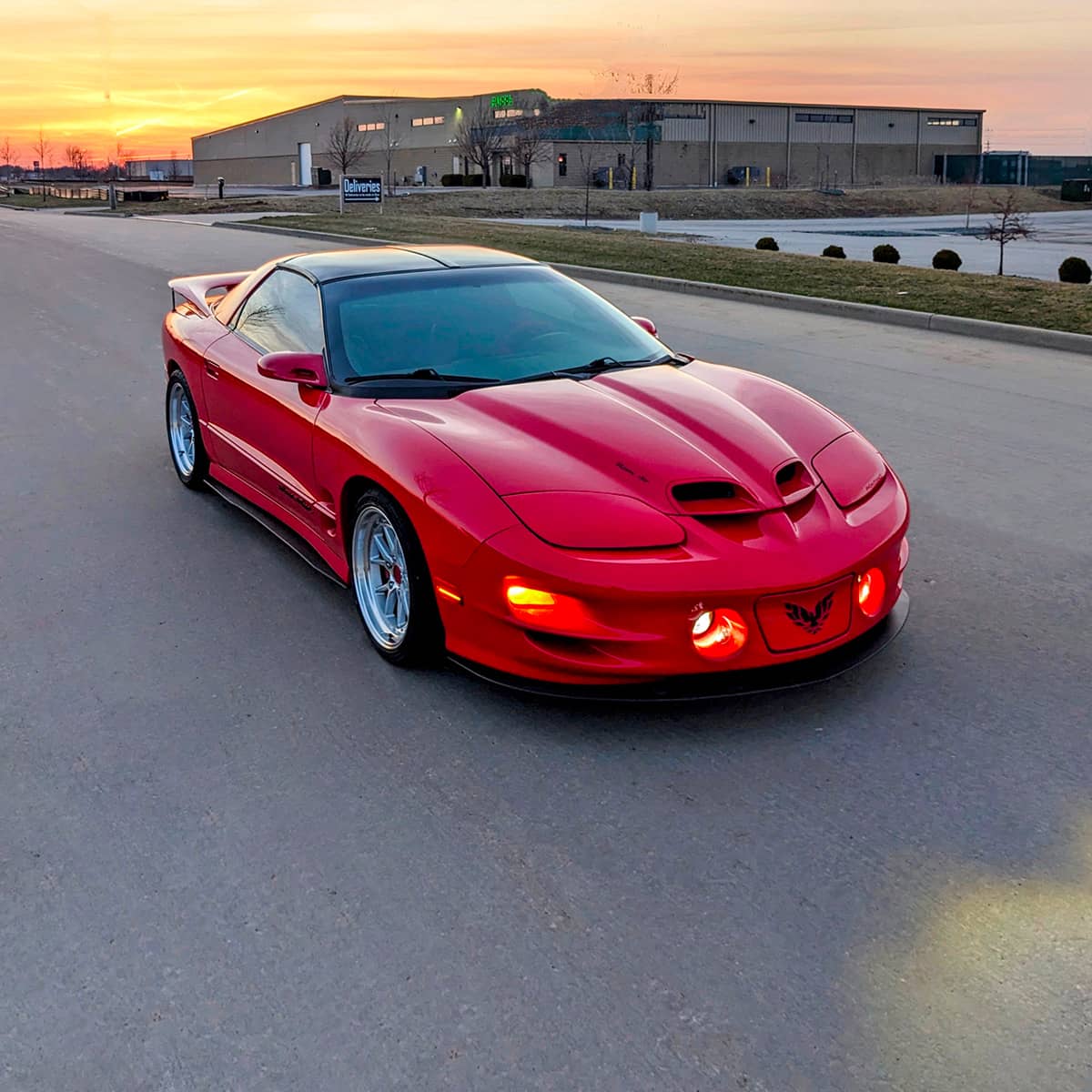 Red 2002 Pontiac Trans AM WS6 ram air hood with functional cut-outs